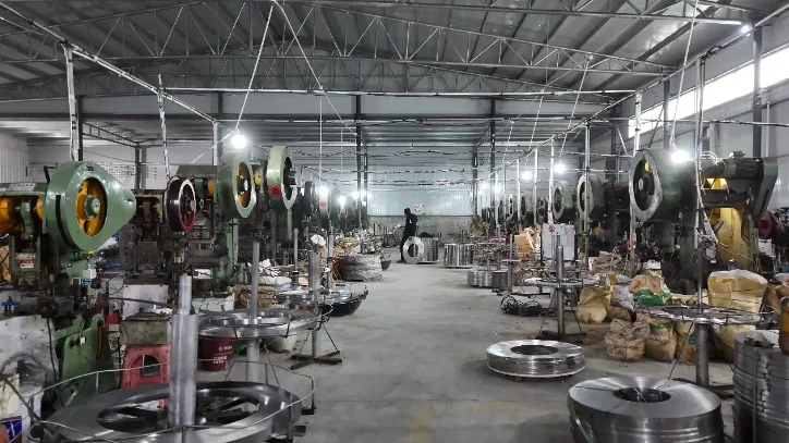 Machines and steel coils inside the Huansheng production workshop